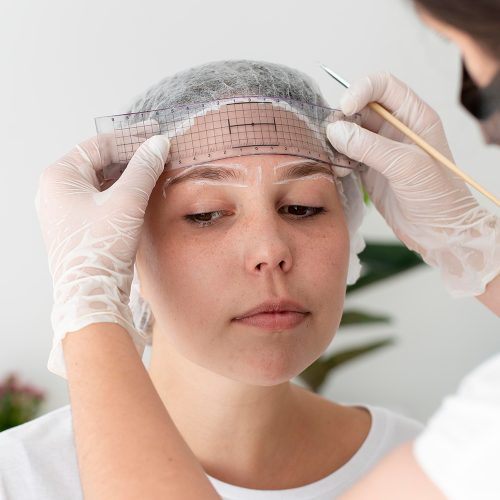 caucasian-woman-going-through-microblading-procedure